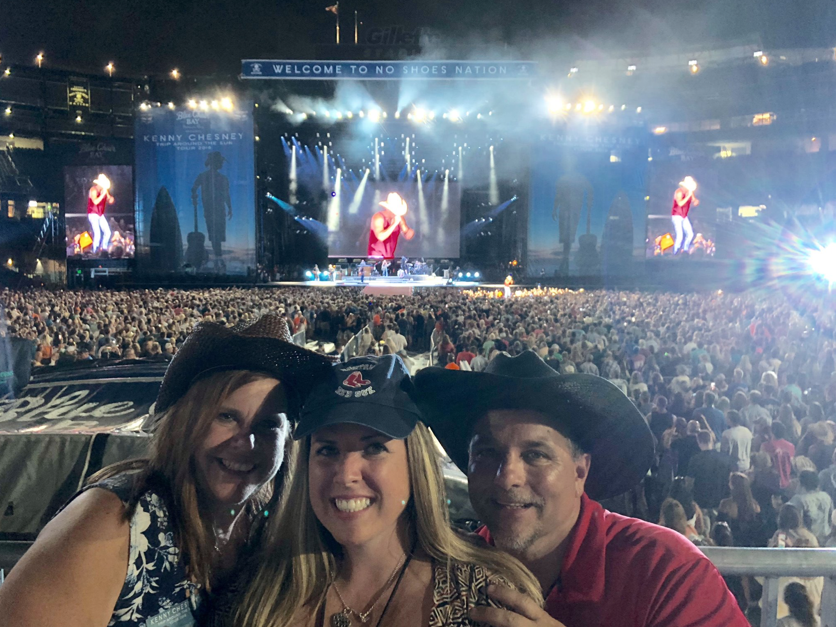 Robert and Jonathan Kraft on stage with Kenny Chesney at his Gillette  Stadium concert